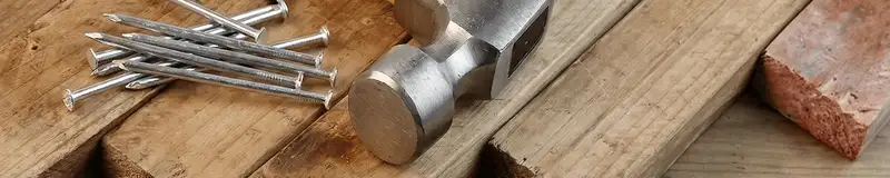 Hammer and nails on hardwood flooring boards in Myrtle Beach, SC