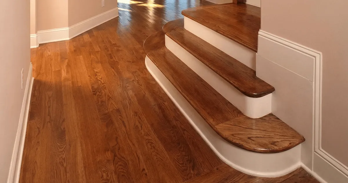 Base floor of a staircase with professionally restored wood flooring in Myrtle Beach SC