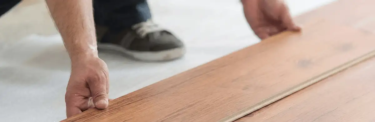 A professional installing laminate flooring in Myrtle Beach, SC